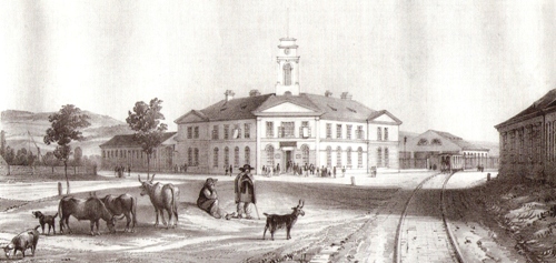  Bratislava - stanica konskej železnice po r. 1846 - výpravná budova, murov. hala, vlak s 1 koňom, ľudi, dobytok (litogr). Faksimile podľa originálu zo zbierok GMB. Anon, cca 1850. 270 x 130 